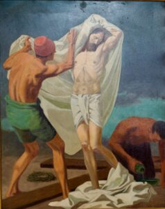 Ein Gemälde zeigt Jesus, der mit geschlossenen Augen steht und von zwei Männern in ein weißes Tuch gehüllt wird. Ein Mann kniet und gießt Flüssigkeit ein; daneben liegen eine Dornenkrone und Holzbalken. Die Szene erweckt Feierlichkeit und Ehrfurcht. (Text mit KI erstellt)